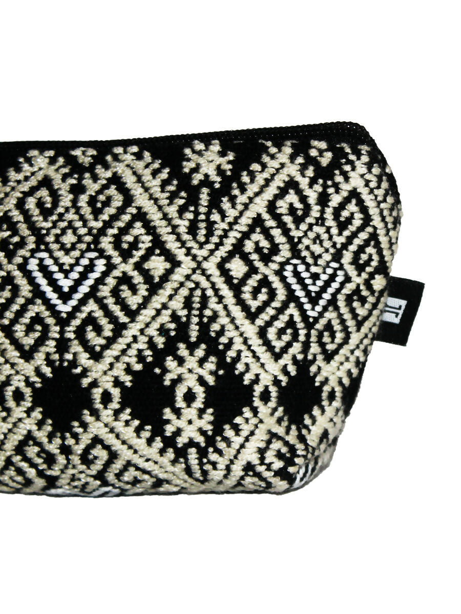 Handwoven and brocade toiletry bag.