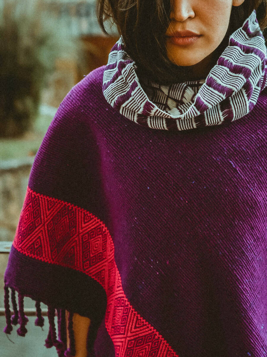 Brocade quechquemitl with turtleneck collar.